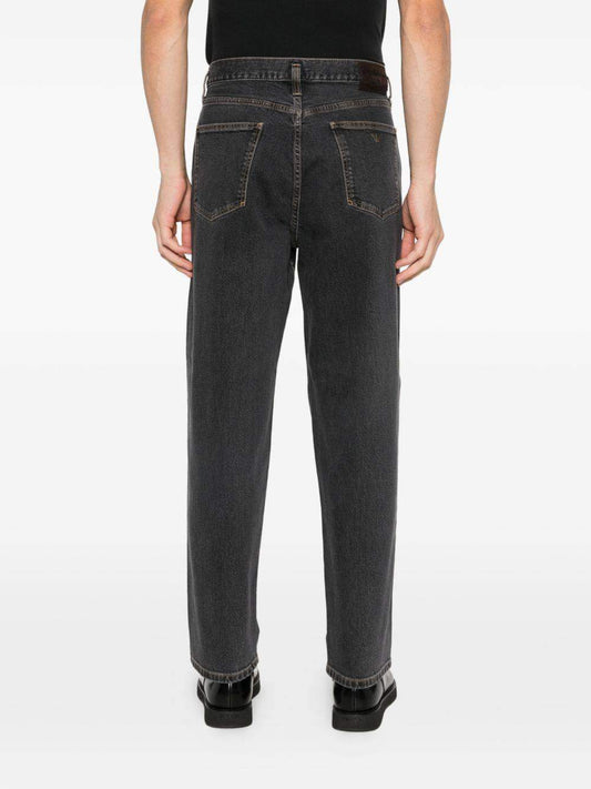 Emporio Armani denim cotton jeans with classic fit and stylish design, shown on a model in a casual setting.