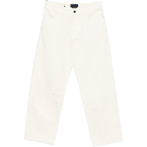 Stone Island denim cotton jeans featuring classic five-pocket design and signature branding, displayed on a neutral background.