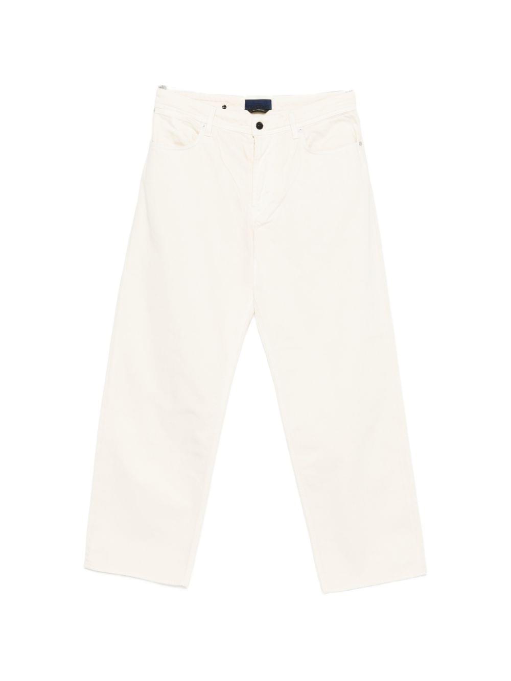 Stone Island denim cotton jeans featuring classic five-pocket design and signature branding, displayed on a neutral background.