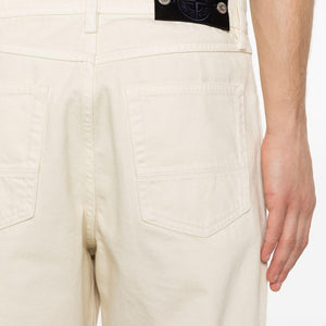 Stone Island Denim cotton jeans showing classic five-pocket design and Stone Island branding on the back pocket.