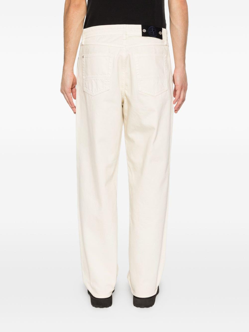 Stone Island Denim cotton jeans showing classic five-pocket design and branded patch on the waistband.