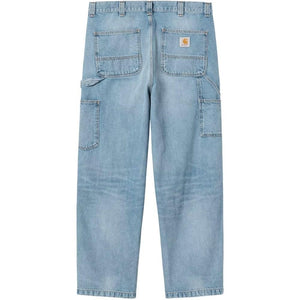 Carhartt Wip Main denim cotton jeans displayed on a hanger, showcasing classic fit and durable fabric with visible stitching details.