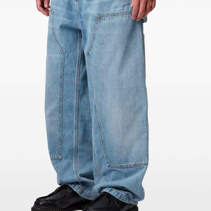 Carhartt Wip Main denim cotton jeans with classic five-pocket design and straight-leg fit, shown hanging on a rack.
