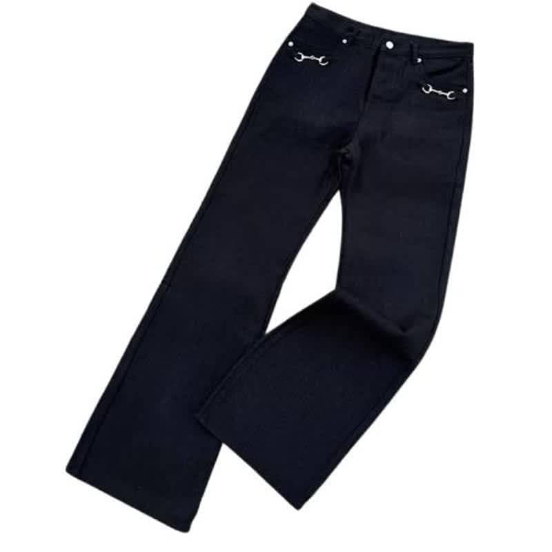 Black flare jeans by Luxenk© featuring a fitted waist and flared legs, styled on a model for a trendy casual look.