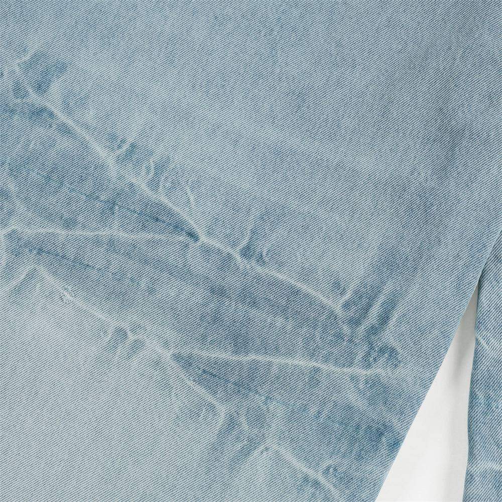 Light blue Luxenk Lightning Wash jeans from eprolo with distressed details and a slim fit, displayed on a mannequin.