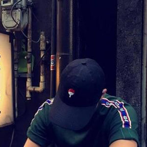 Black LUXENK Uchiha cap by eprolo featuring the iconic red and black Uchiha clan symbol embroidered on the front.