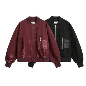 Eprolo LUXENK® "Home Run" jacket in black, featuring a stylish design with zipper details and adjustable cuffs.