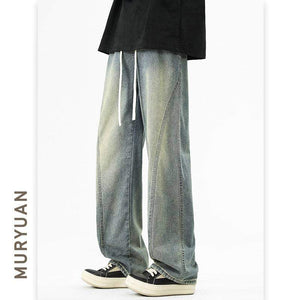 Light blue and gray wash denim jeans from LUXENK©, eprolo, featuring classic five-pocket design and relaxed fit.