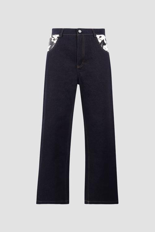 Dark blue denim jeans with cow pocket design from LUXENK© "Cow Pocket" JEANS by Hideout, showing front view with pockets and stitching details.