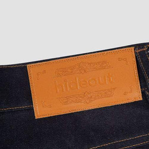 Dark denim LUXENK© Cow Pocket jeans by Hideout featuring a classic five-pocket design and distinctive cow print detail.