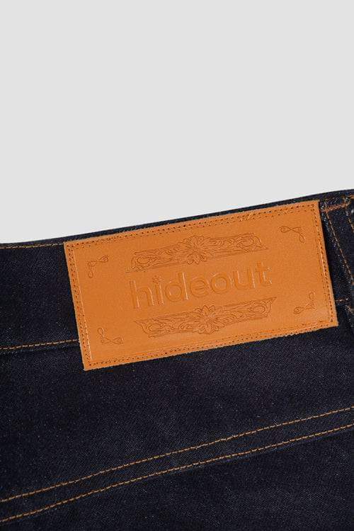 Dark denim LUXENK© Cow Pocket jeans by Hideout featuring a classic five-pocket design and distinctive cow print detail.