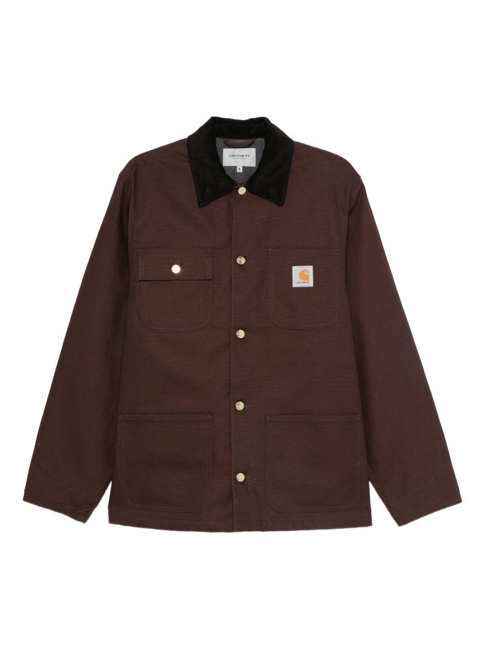 Carhartt Wip Main jacket in black, men's casual outerwear with durable fabric and classic design, displayed on a hanger.