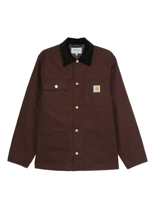 Carhartt Wip Main jacket in black, men's casual outerwear with durable fabric and classic design, displayed on a hanger.