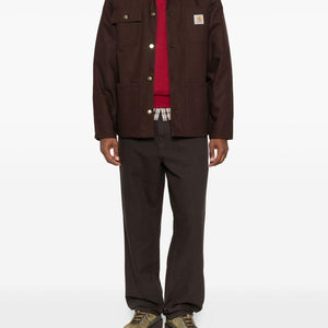 Carhartt Wip Main jacket, a durable men's outdoor jacket in black with front pockets and Carhartt branding.