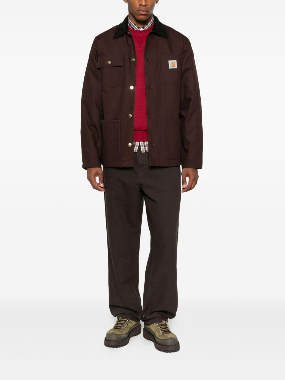 Carhartt Wip Main jacket, a durable men's outdoor jacket in black with front pockets and Carhartt branding.