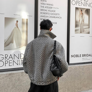 Black LUXENK© Monochrome Grid Jacket by eprolo, shown on a model, featuring a modern grid pattern and stylish design.