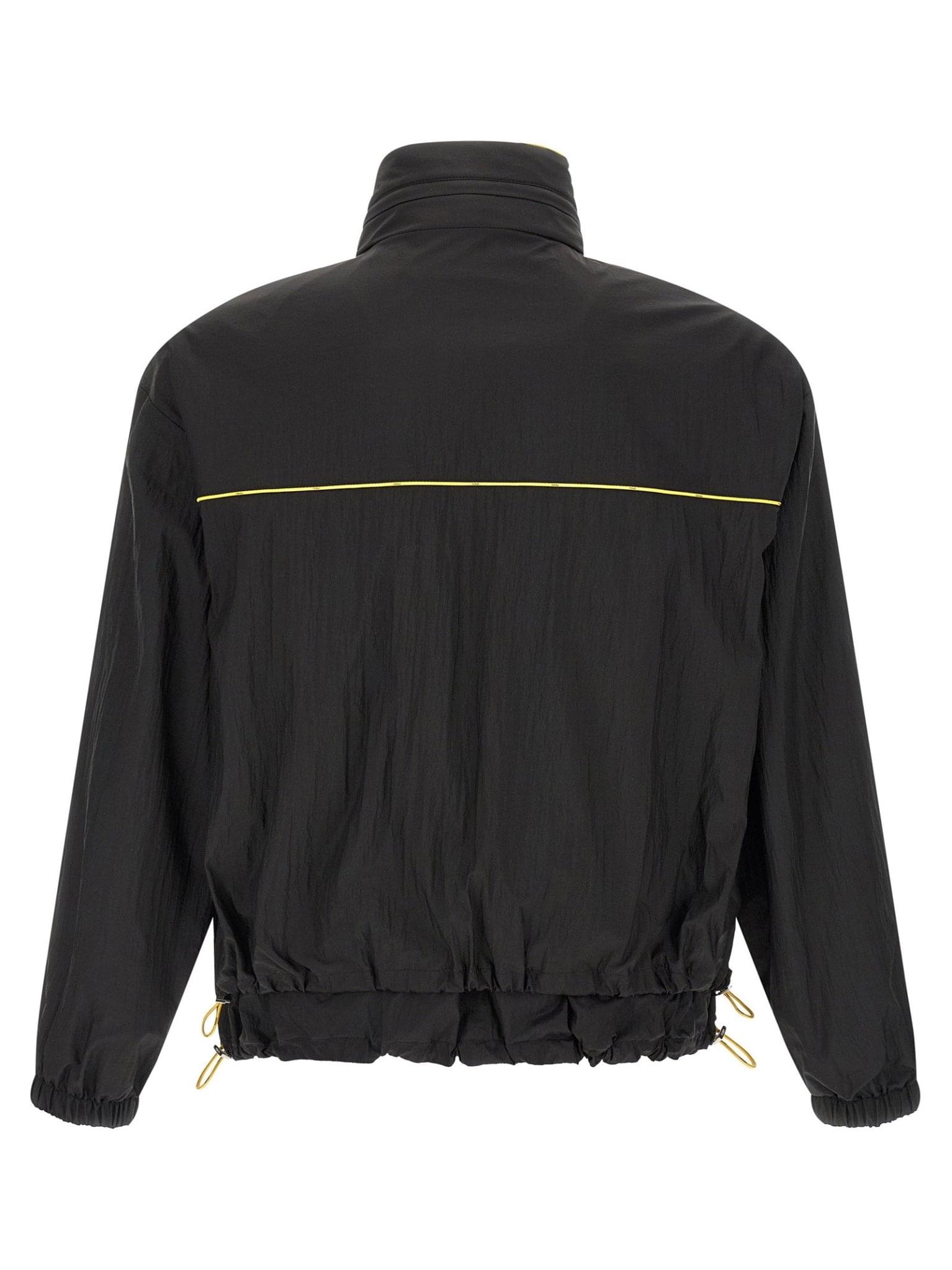 Fendi reversible windbreaker jacket featuring sleek design, with visible Fendi logo and stylish two-tone fabric in the image.