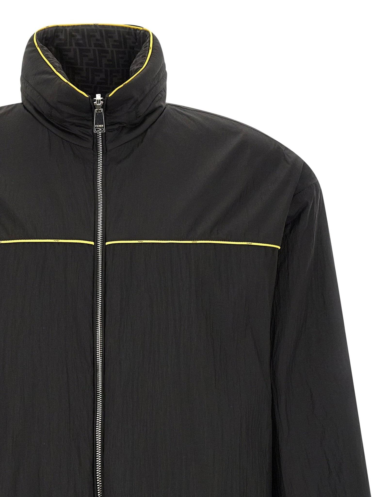 Fendi reversible windbreaker jacket with sleek design, featuring both solid and patterned sides, lightweight and stylish outerwear.
