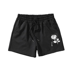 Black and white LUXENK Graphic Print Track Shorts with large floral design, casual athletic style, and comfortable fit.