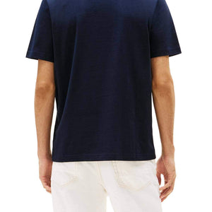 Navy blue Tommy Hilfiger men's T-shirt with logo, short sleeves, casual fit, and crew neck.
