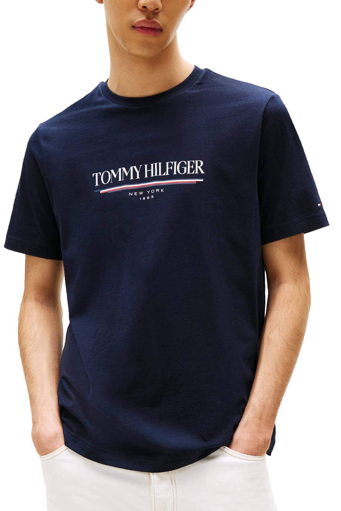 Navy blue Tommy Hilfiger men's short-sleeve T-shirt with logo, size L, featuring classic crew neck and logo print on front.