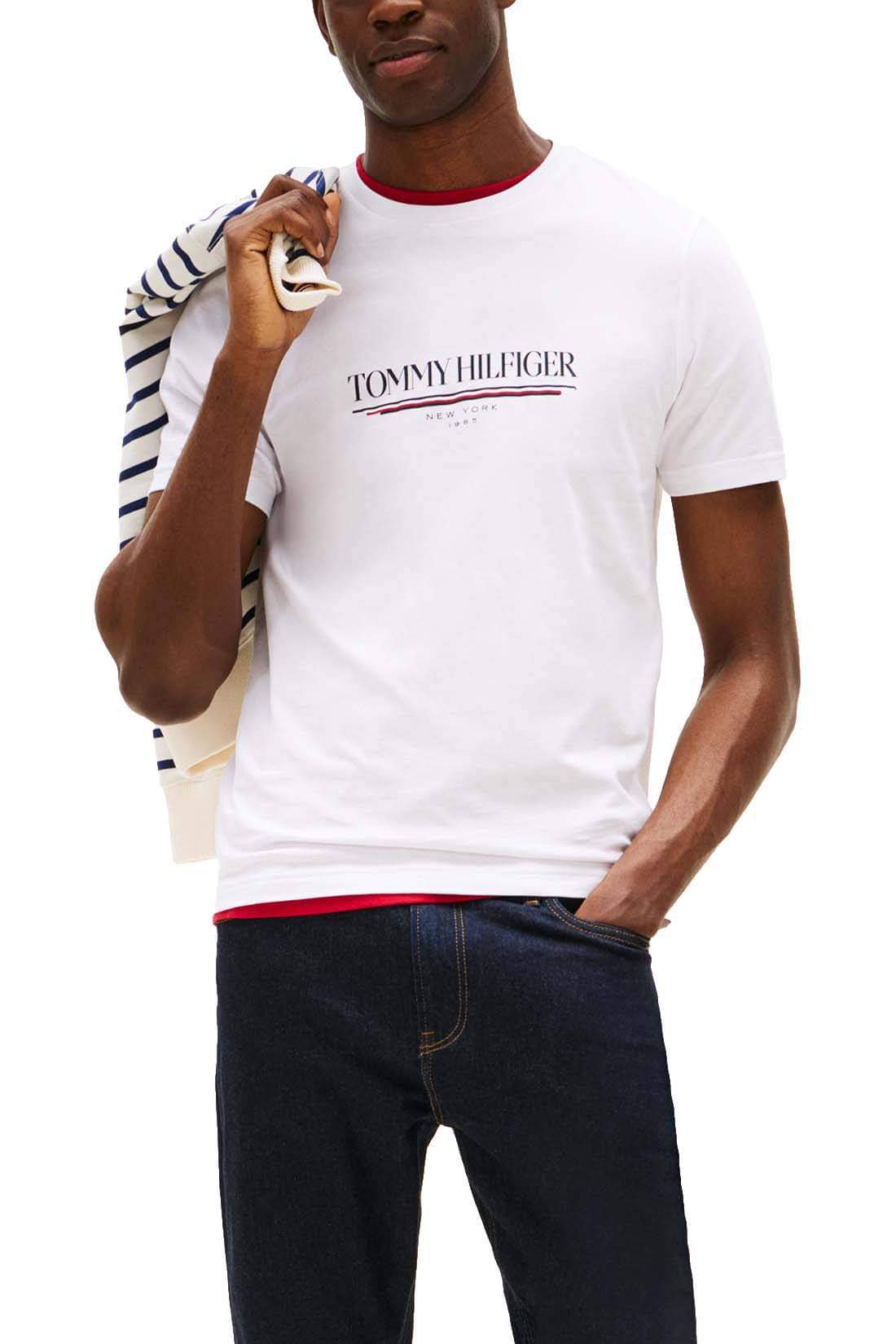 White Tommy Hilfiger men's short sleeve T-shirt with logo print, size L, casual style.