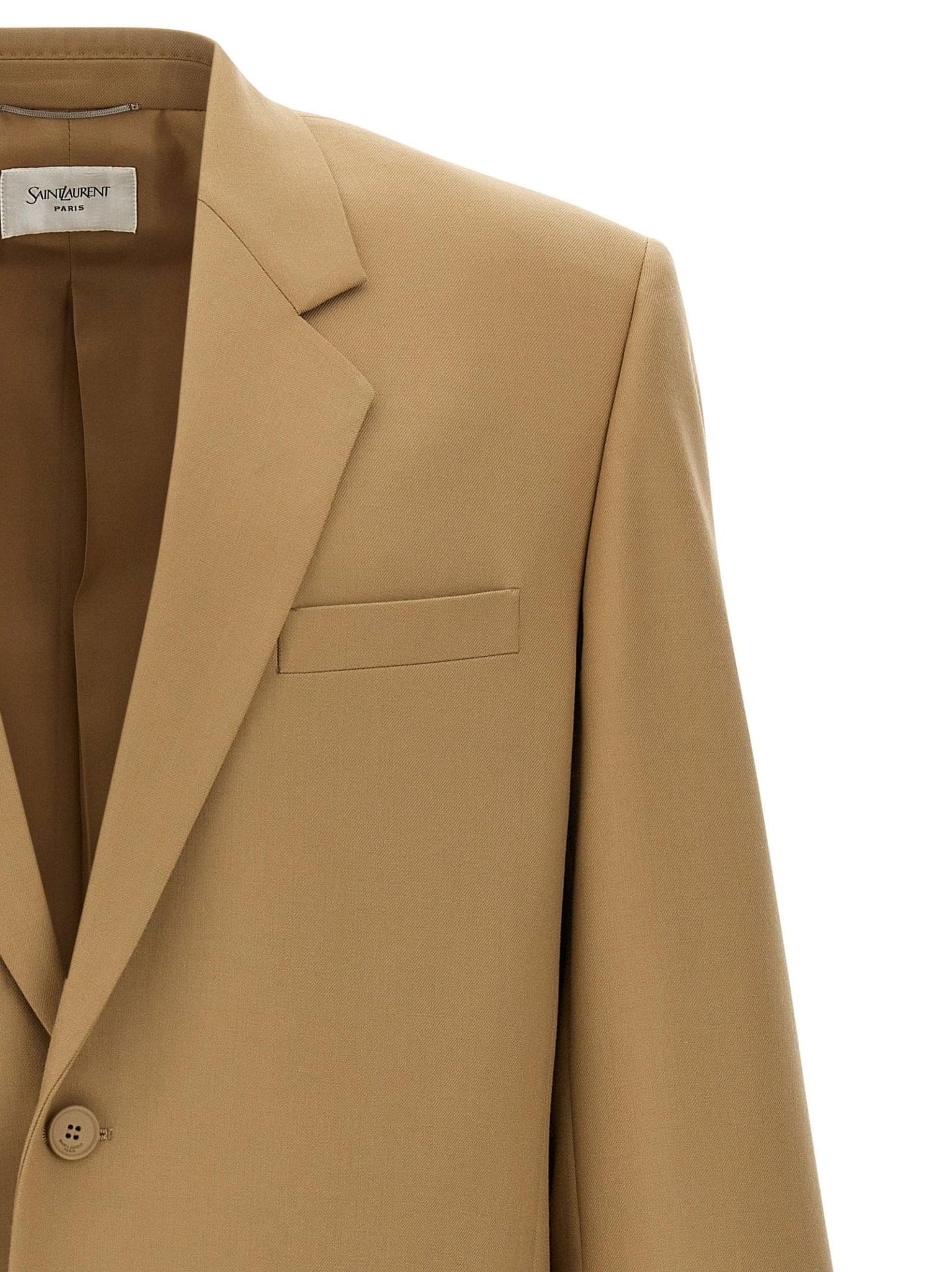 Saint Laurent Yves blazer jacket in black with tailored fit and classic lapel, displayed on a hanger.