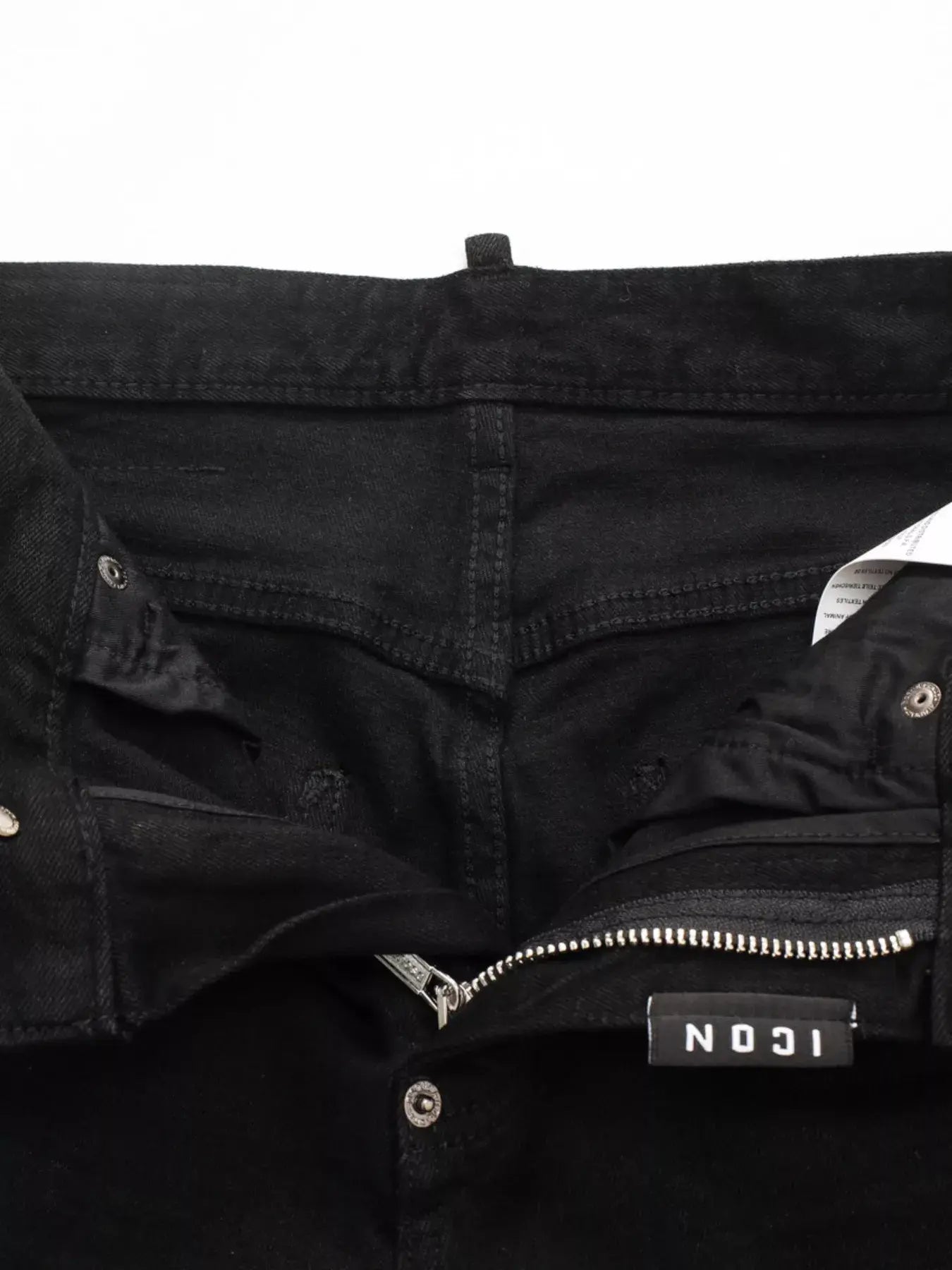 Black LUXENK© Slim Fit Jeans by Trendsi, showcasing a close-up of the fitted denim fabric and clean stitching.