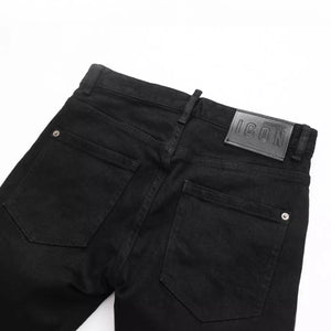 Black Luxenk Slim Fit Jeans by Trendsi, showing a close-up of the sleek, fitted denim with stitching details and a classic waistband.