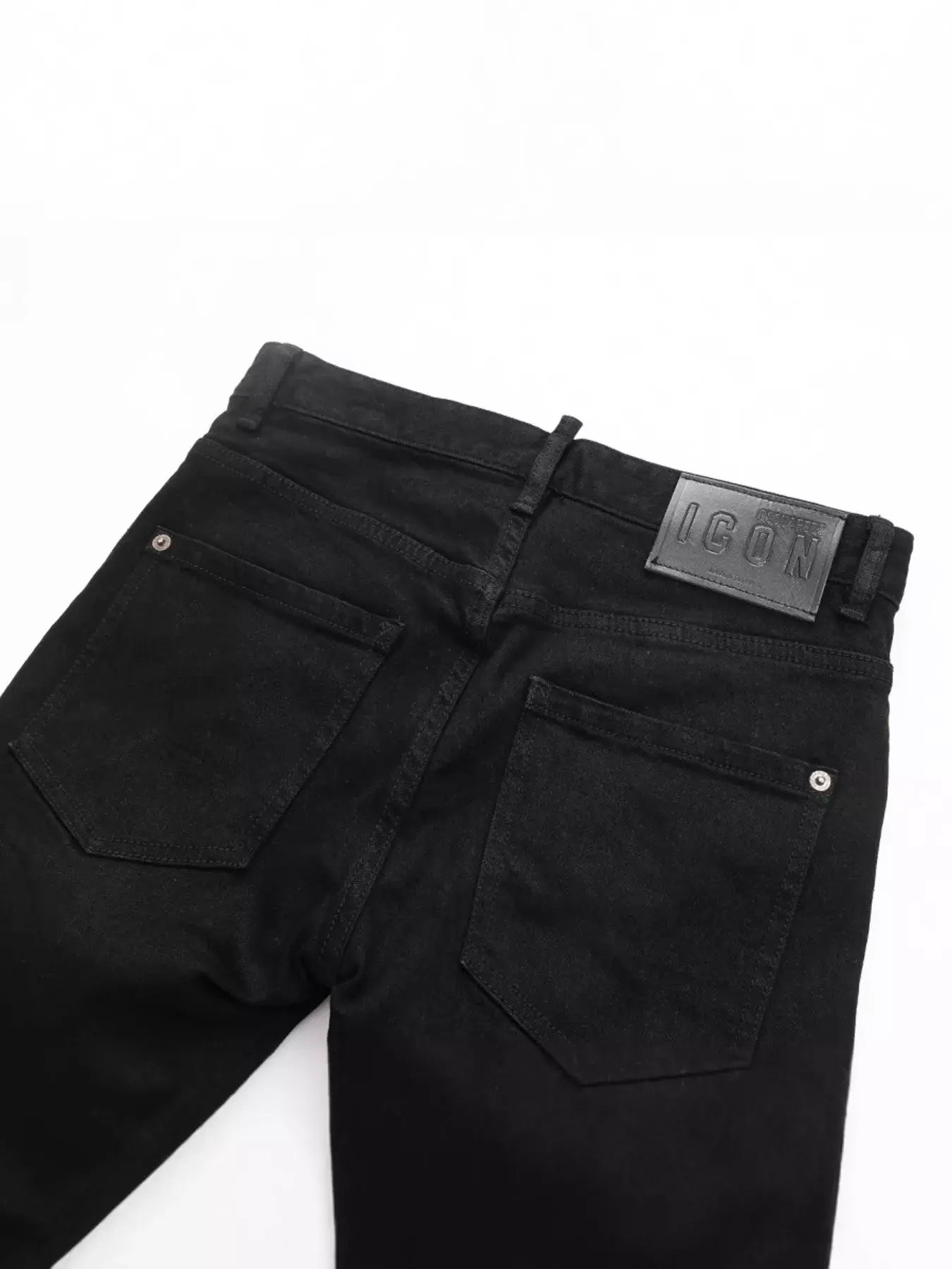 Black Luxenk Slim Fit Jeans by Trendsi, showing a close-up of the sleek, fitted denim with stitching details and a classic waistband.