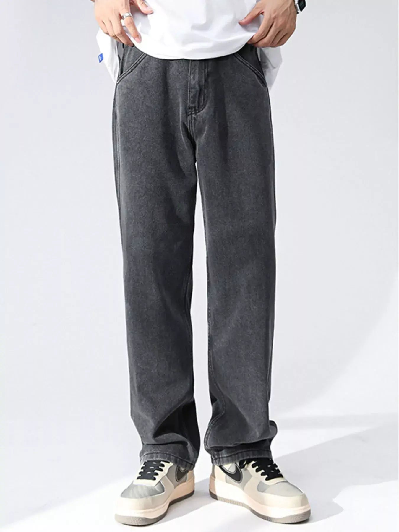 Black and gray Luxenk Relaxed Wide Leg Jeans by Trendsi, showing the comfortable, loose fit and stylish denim fabric.