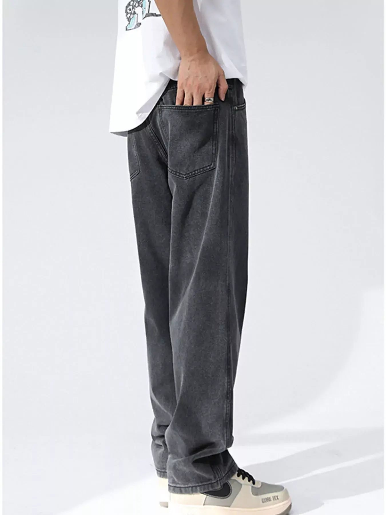 Black and gray Luxenk Relaxed Wide Leg Jeans by Trendsi, showing the loose fit and casual style with visible fabric texture.