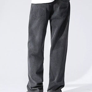 Black and gray Luxenk Relaxed Wide Leg Jeans by Trendsi, showing fit and fabric details on a model.