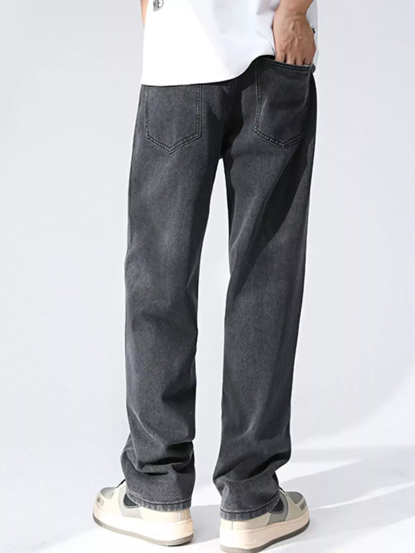 Black and gray Luxenk Relaxed Wide Leg Jeans by Trendsi, showing fit and fabric details on a model.