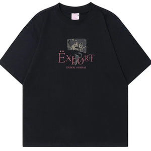 Black LUXENK© "Graphic" T-shirt from Trendsi, featuring a bold graphic design on soft cotton fabric.