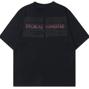 Black LUXENK© "Graphic" T-shirt from Trendsi featuring bold printed design on soft, casual cotton fabric.