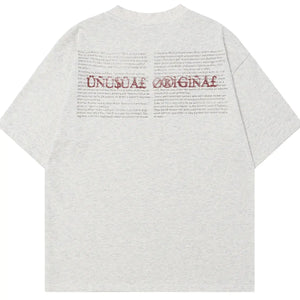 Black LUXENK© Graphic T-shirt by Trendsi, featuring a stylish printed design on soft cotton fabric.