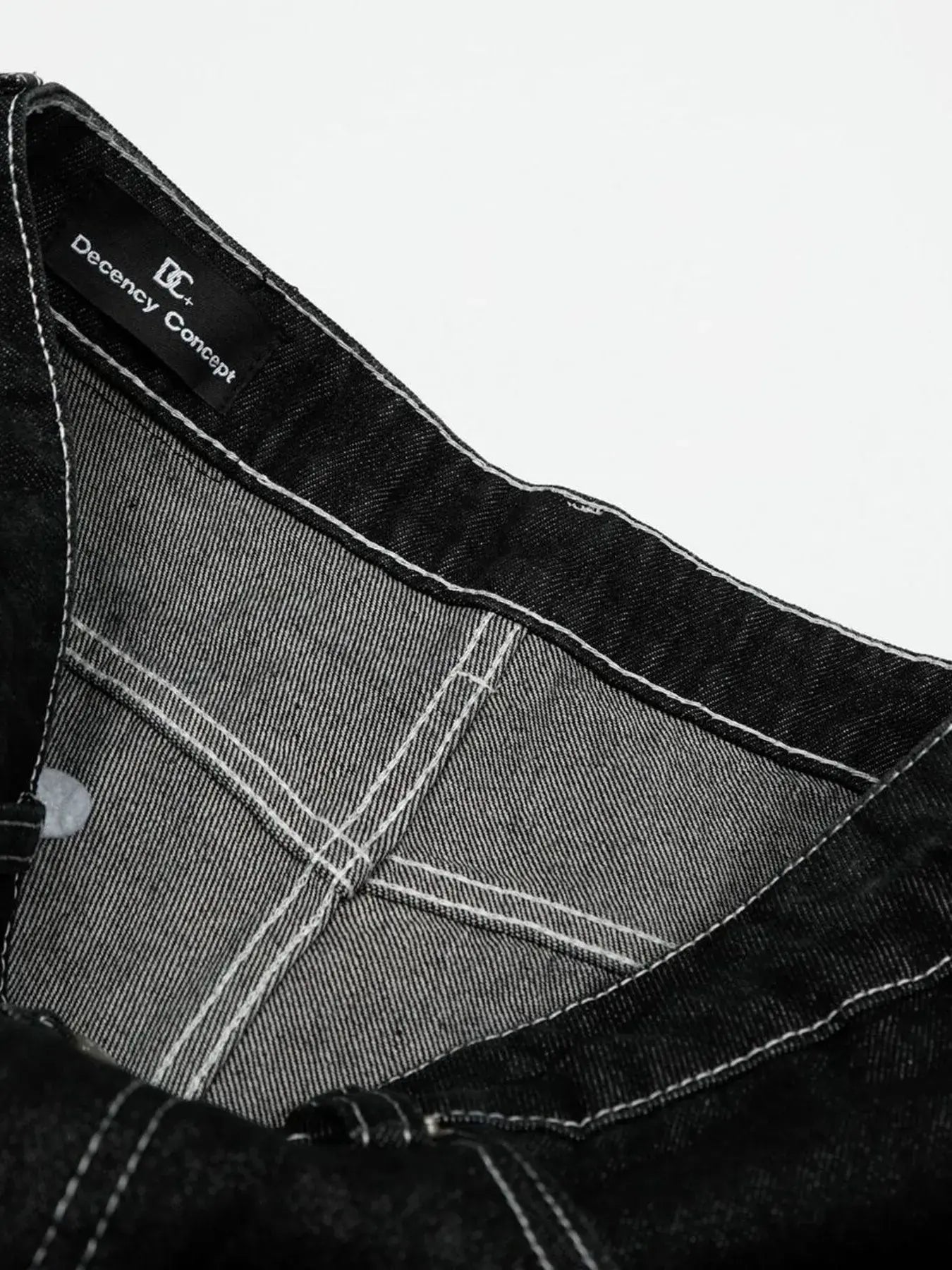 Black Luxenk Contrast Stitch Jeans by Trendsi featuring classic denim with contrasting stitching and a slim fit design.