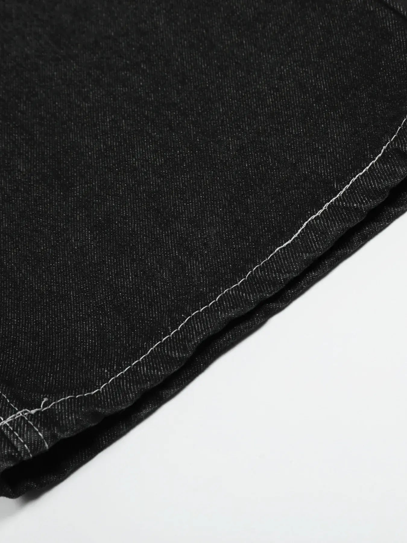 Black LUXENK Contrast Stitch Jeans by Trendsi, showing fitted style with prominent contrast stitching and classic five-pocket design.