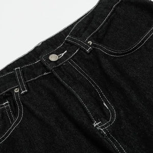 Black Luxenk Contrast Stitch Jeans by Trendsi featuring classic stitching, slim fit, and stylish design on a model.