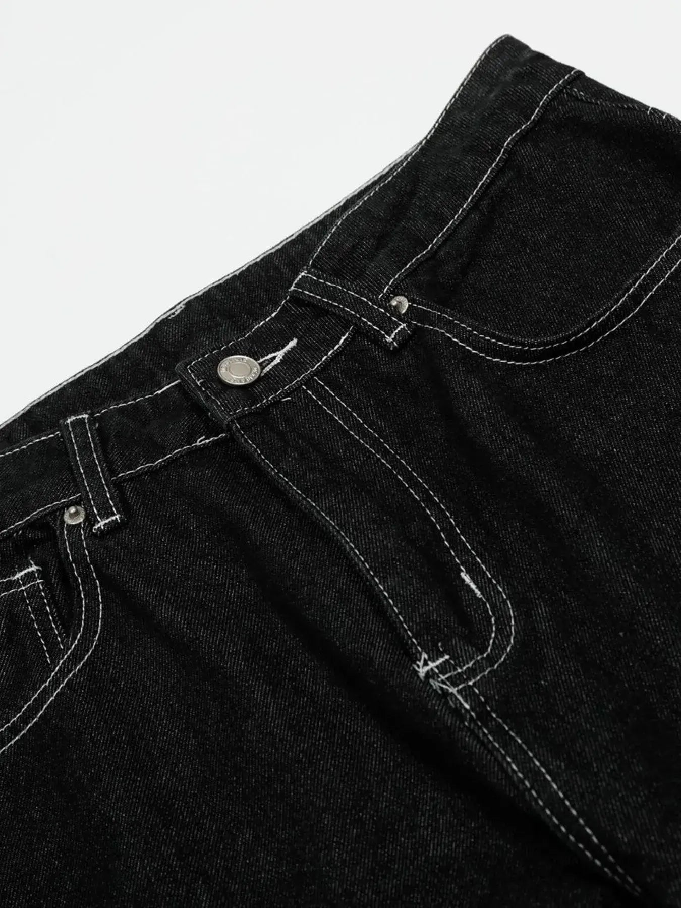 Black Luxenk Contrast Stitch Jeans by Trendsi featuring classic stitching, slim fit, and stylish design on a model.