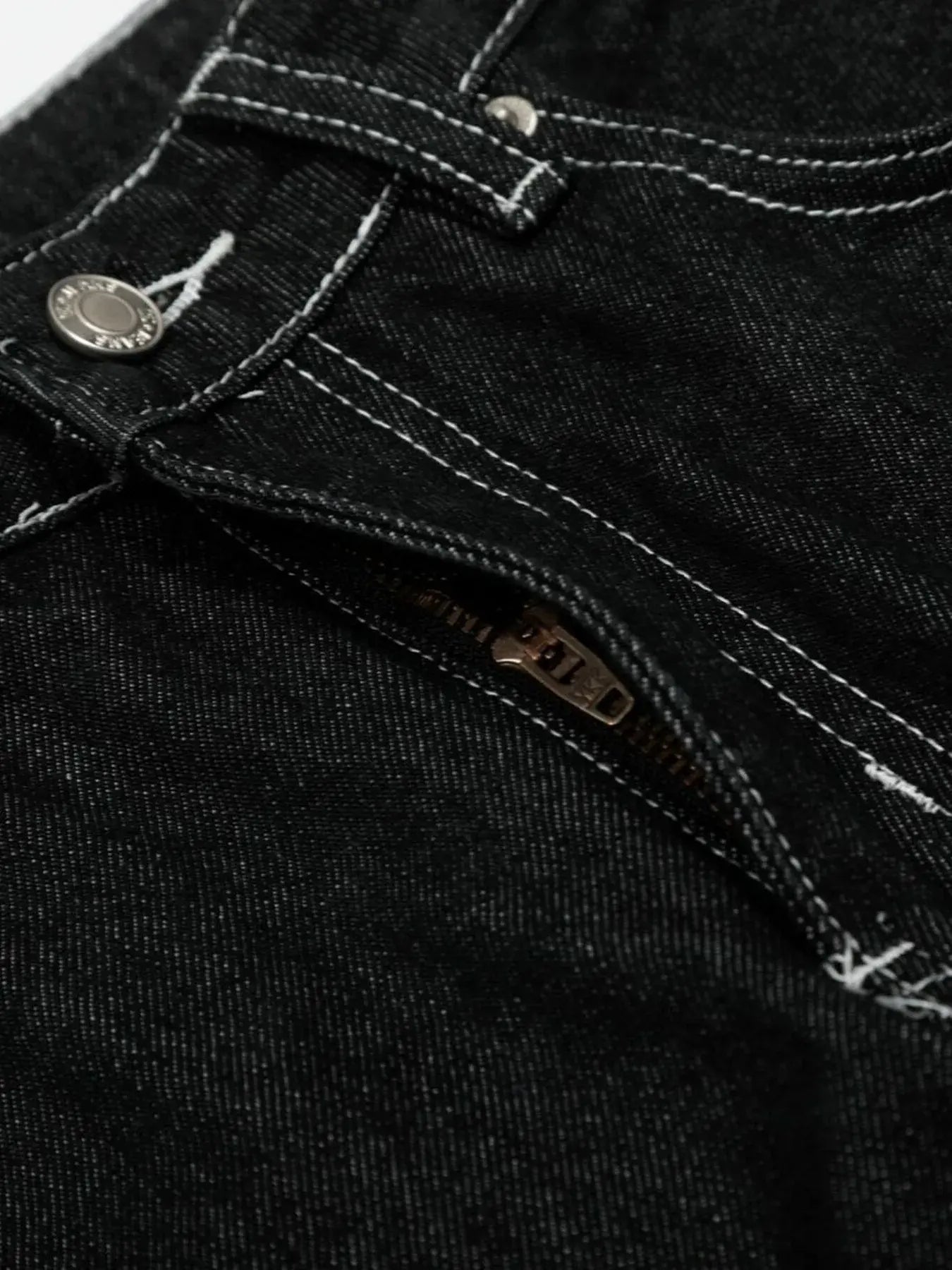 Black LUXENK Contrast Stitch Jeans by Trendsi featuring classic stitching and a slim fit, displayed on a white background.