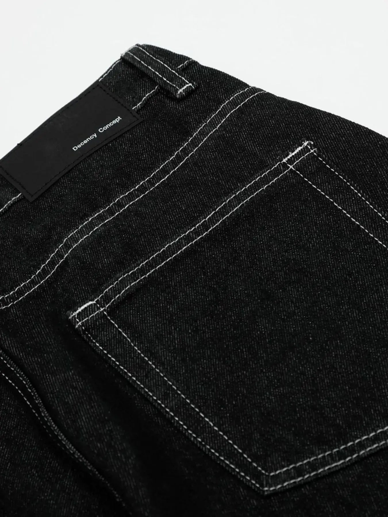Black LUXENK© Contrast Stitch Jeans by Trendsi, featuring classic stitching and a slim fit, displayed on a white background.