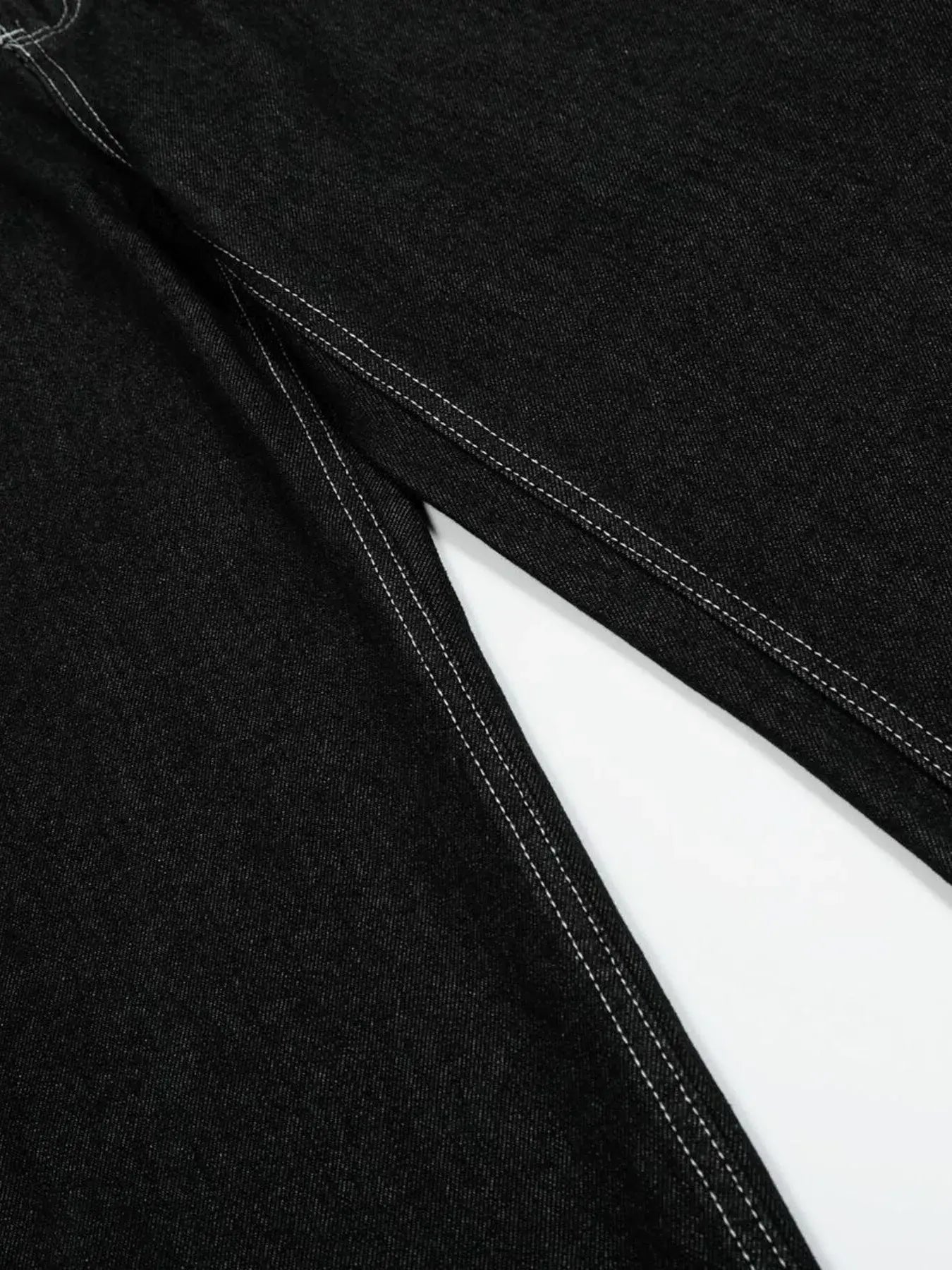 Black LUXENK Contrast Stitch Jeans by Trendsi featuring classic denim with contrast stitching and a slim fit style.
