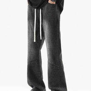 Black Luxenk Drawstring Wide Leg Jeans by Trendsi, showing the relaxed fit and stylish casual design with a drawstring waist.