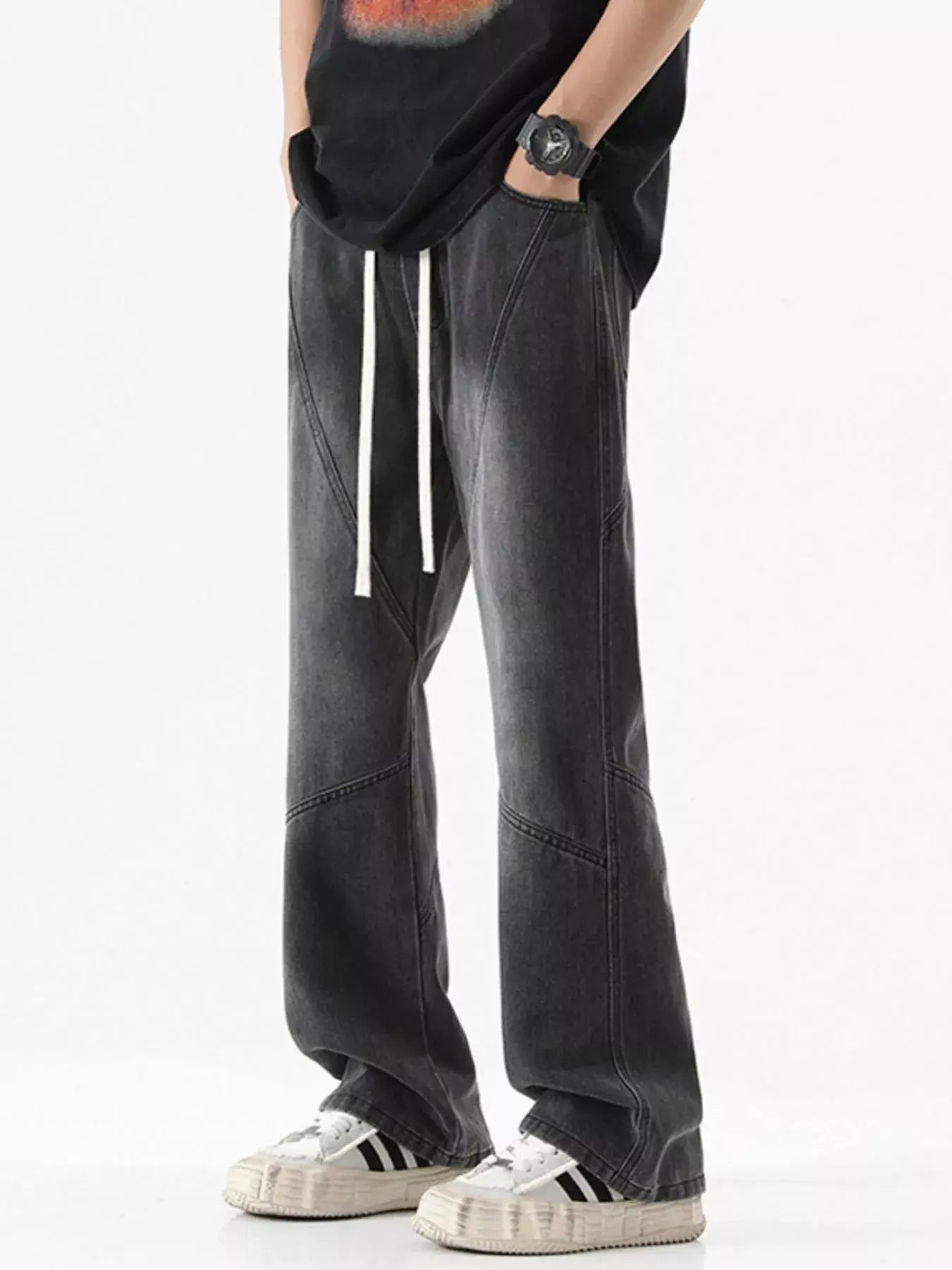 Black Luxenk Drawstring Wide Leg Jeans by Trendsi, showing the relaxed fit and stylish casual design with a drawstring waist.
