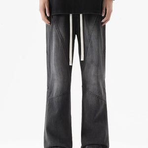 Black Luxenk drawstring wide-leg jeans from Trendsi, featuring a relaxed fit, high waist, and casual style.