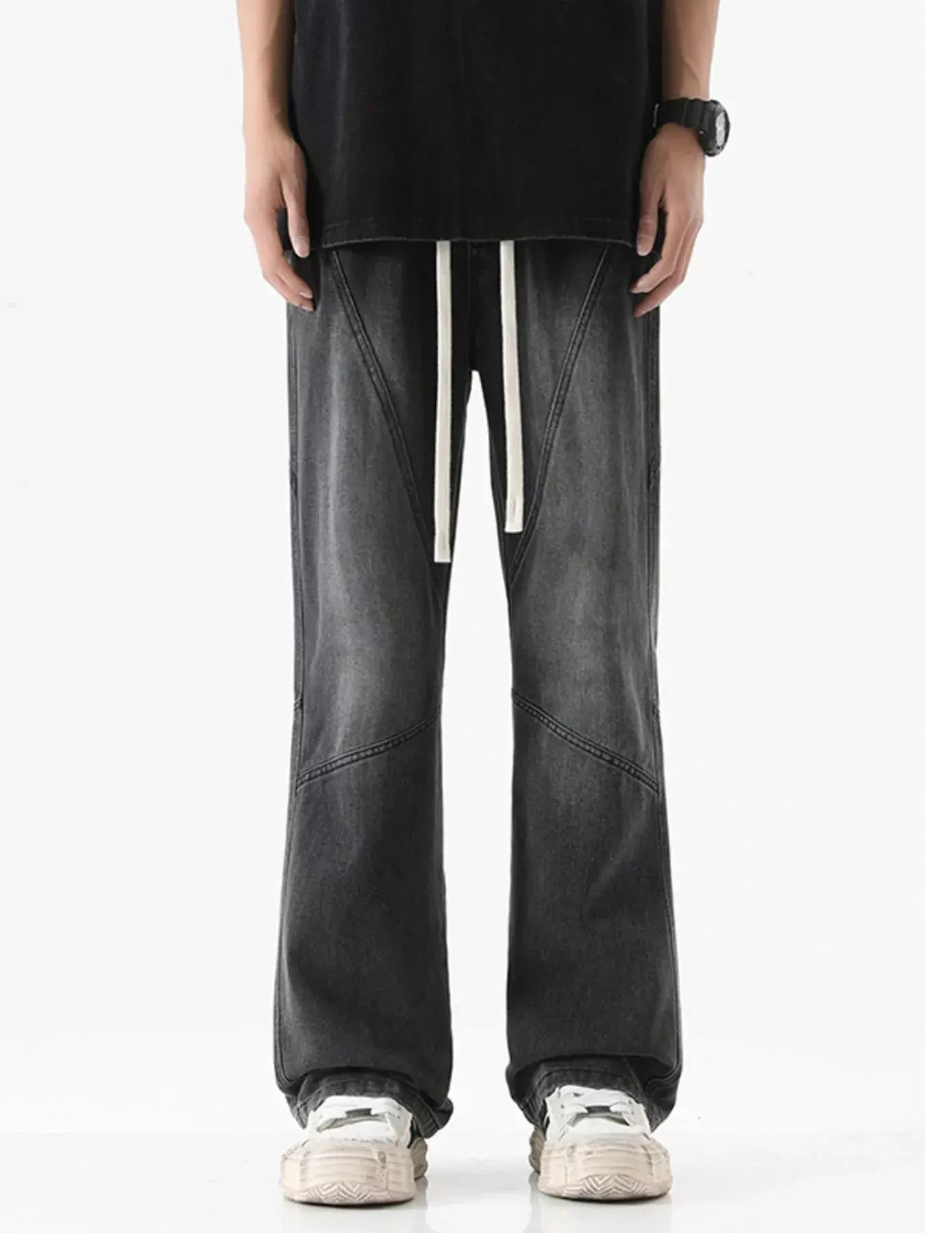 Black Luxenk drawstring wide-leg jeans from Trendsi, featuring a relaxed fit, high waist, and casual style.