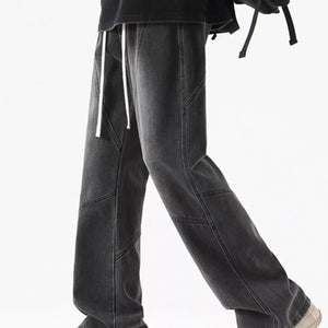 Black LUXENK© Drawstring Wide Leg Jeans by Trendsi, featuring a relaxed fit and adjustable waist, shown on a model.