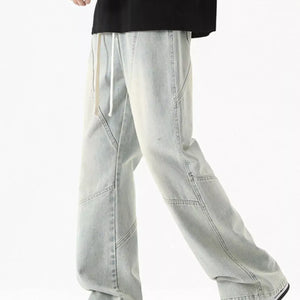 Black Luxenk Drawstring Wide Leg Jeans by Trendsi, featuring a relaxed fit and casual style with a drawstring waist and wide legs.